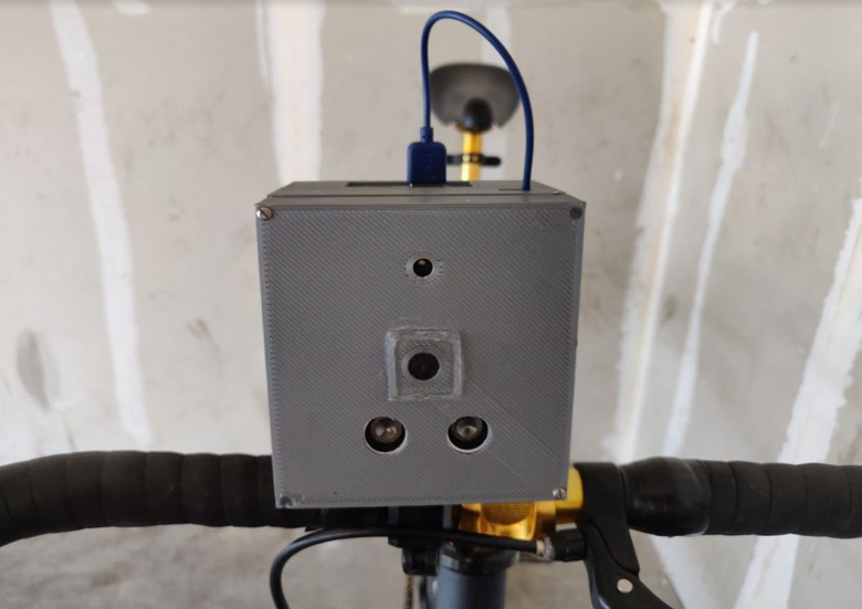 fully-assembled device mounted on bike handlebars