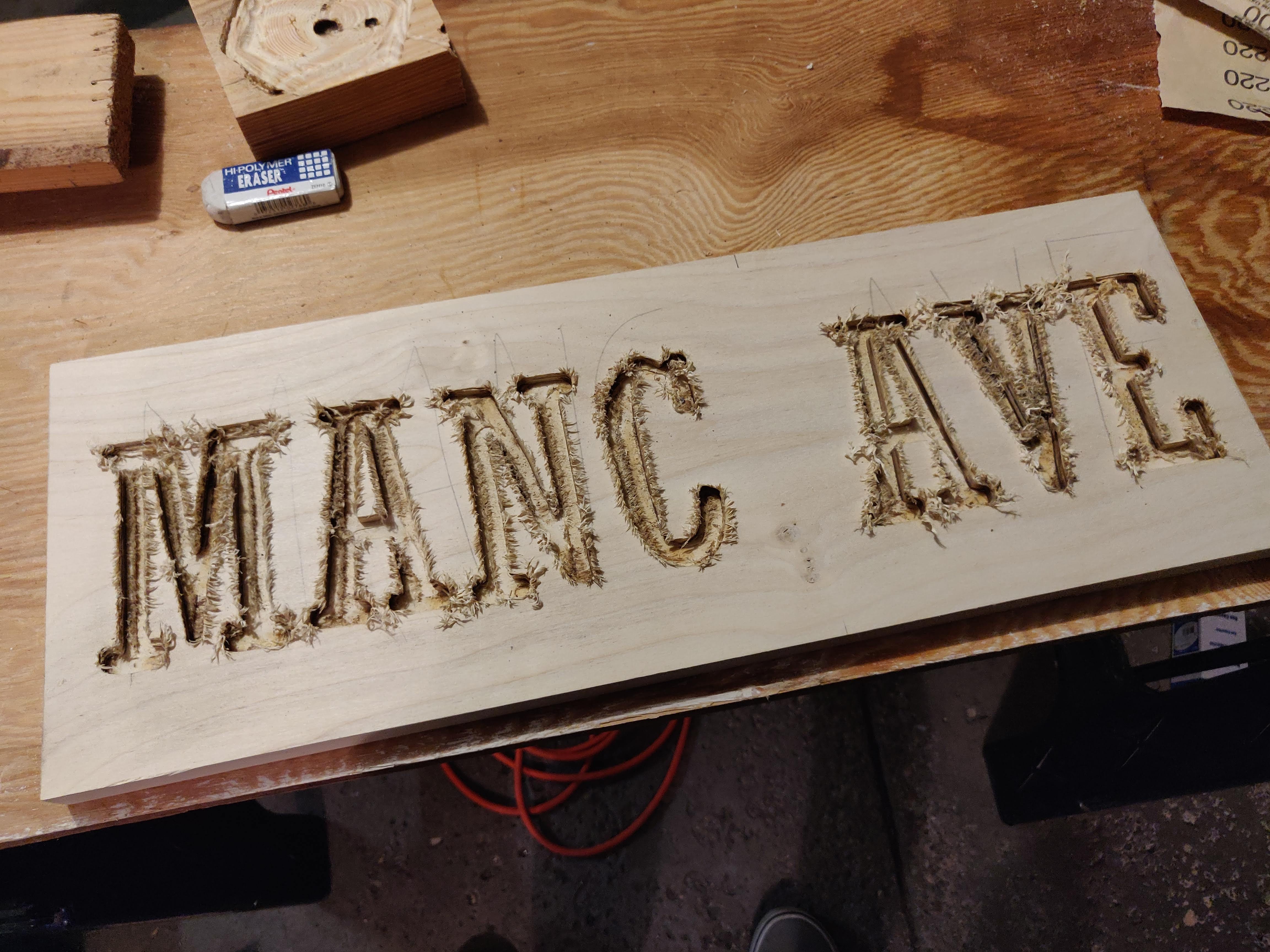 sign with wood burrs around letters