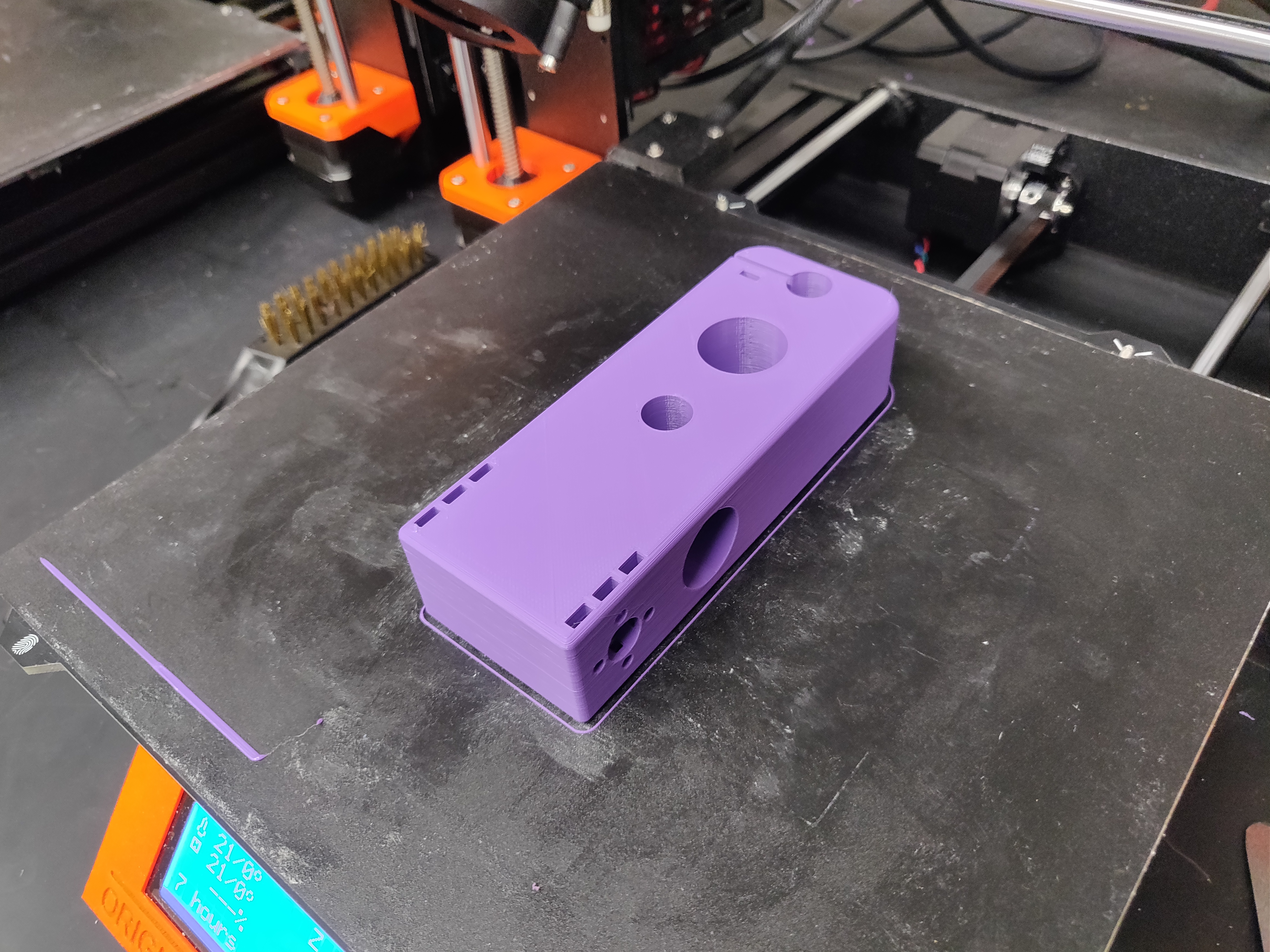 3D printed part laying on print bed